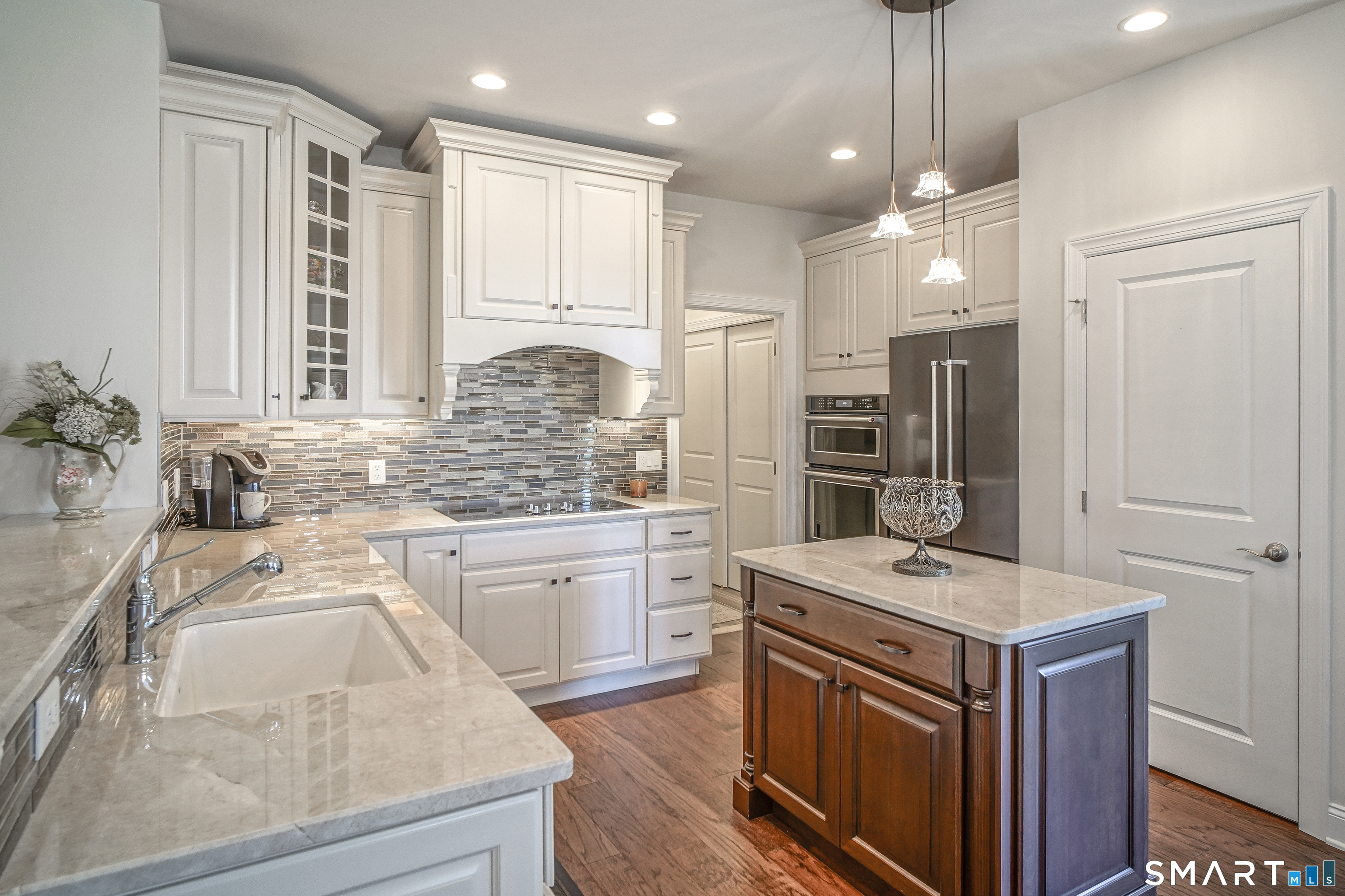 28 Tamarack Court, Unit 28 Prospect, CT 06712 - Photo 7 of 40 Beautiful pendant lighting complemented by additional designer ceiling lights.