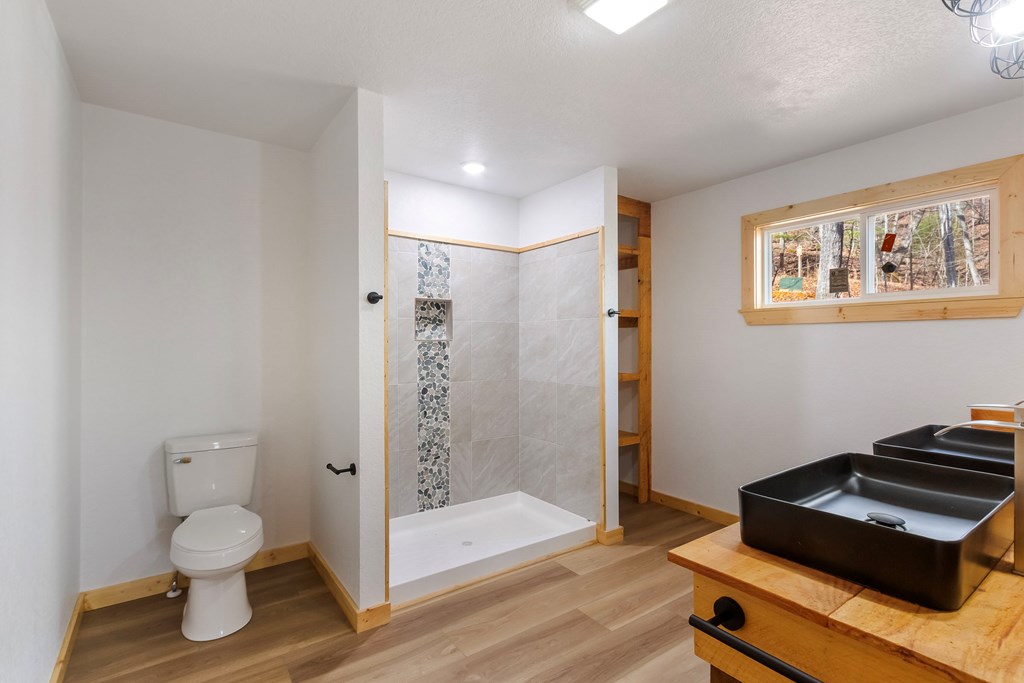 87 Tuscarora Trail Murphy, NC 28906 - Photo 46 of 74 a bathroom with a toilet and a shower