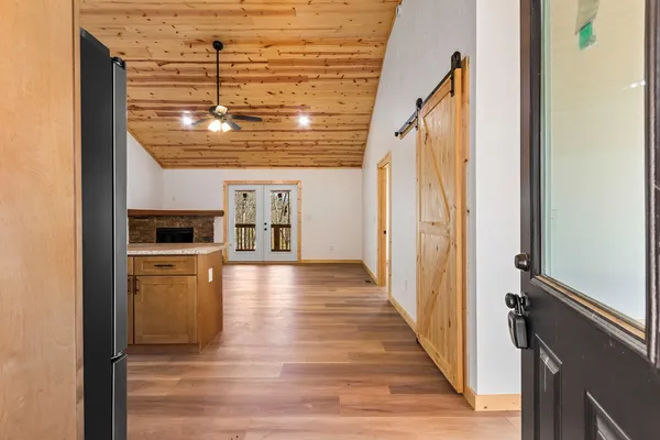 a kitchen with granite countertop stainless steel appliances and wooden cabinets