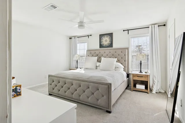 a bed room with a bed and a window