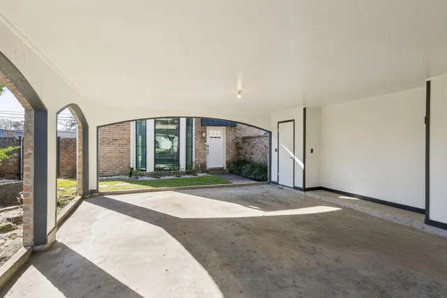 a view of a big room with large windows