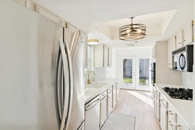 a view of a kitchen from a dining room