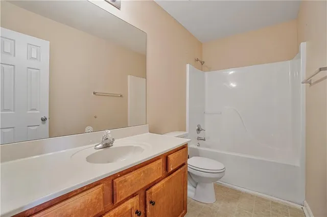 a bathroom with a sink toilet tub and shower