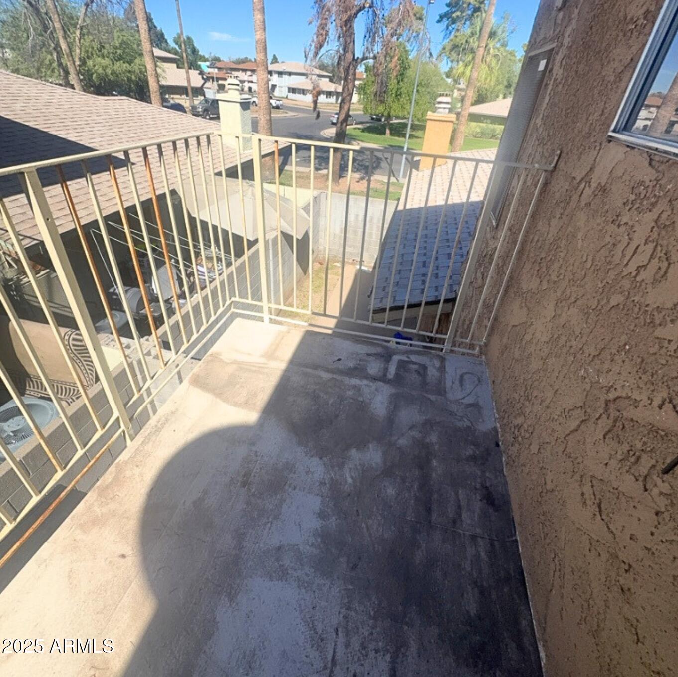 3313 West Harmont Drive, Unit 3 Phoenix, AZ 85051 - Photo 7 of 7 a view of balcony with wooden floor and fence