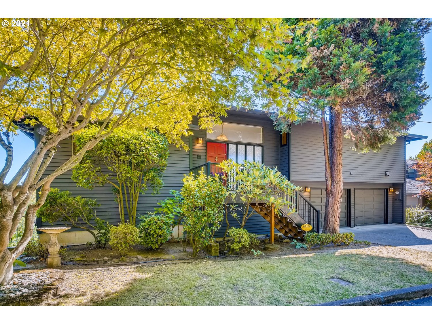 6530 Southwest View Point Terrace Portland, OR 97239 - Photo 2 of 32 a front view of a house with a yard