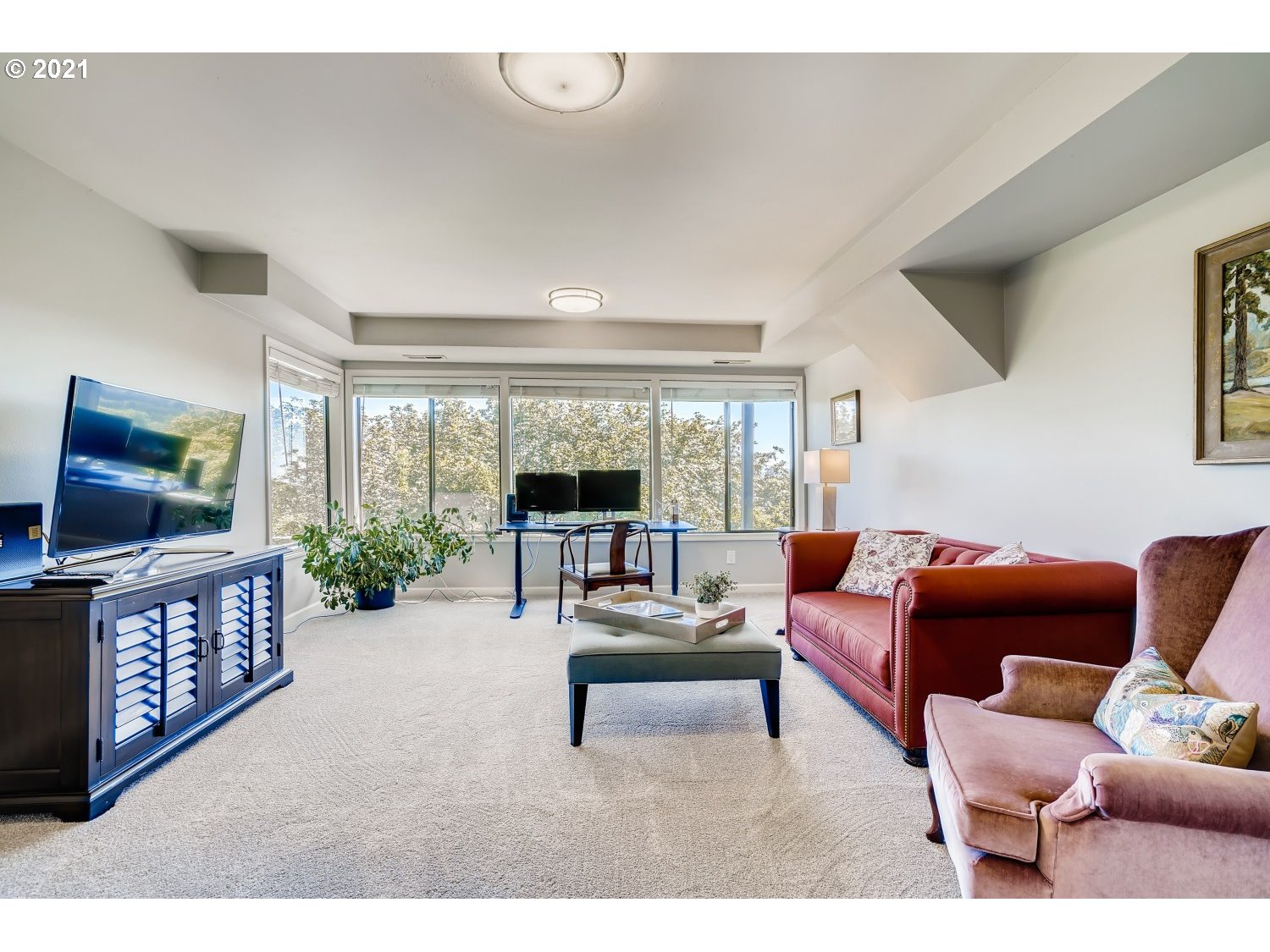 6530 Southwest View Point Terrace Portland, OR 97239 - Photo 24 of 32 a living room with furniture and a flat screen tv