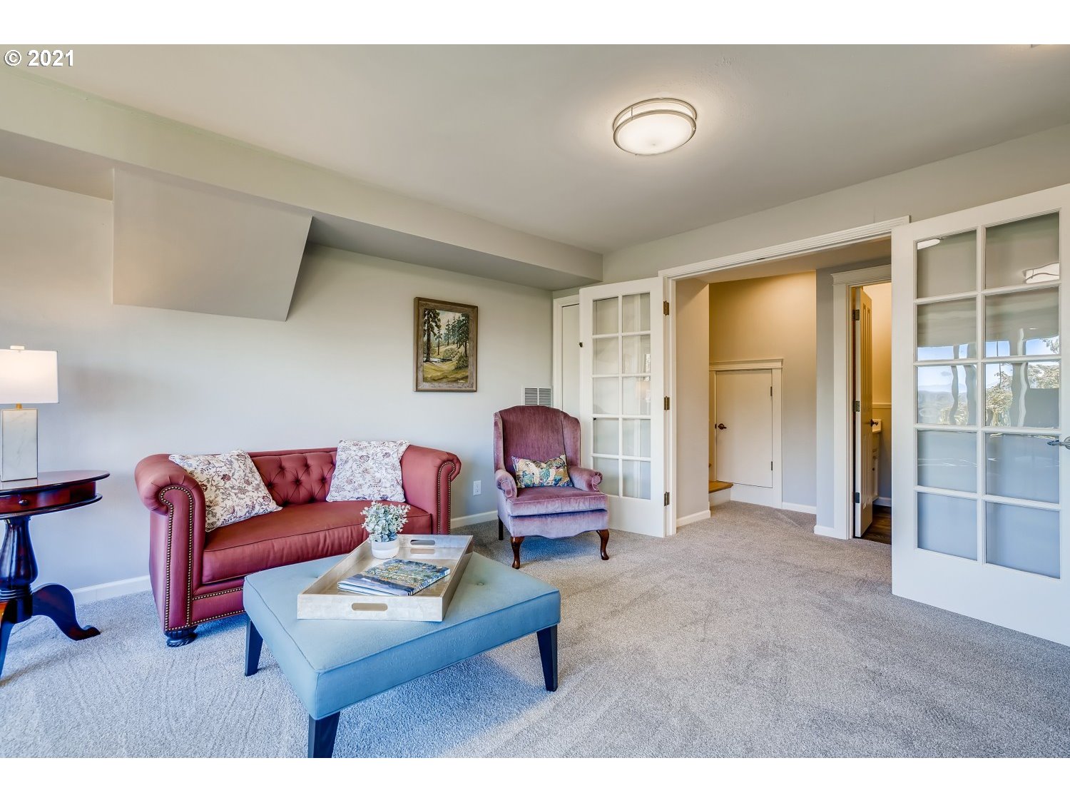 6530 Southwest View Point Terrace Portland, OR 97239 - Photo 25 of 32 a living room with furniture a ceiling fan and a window