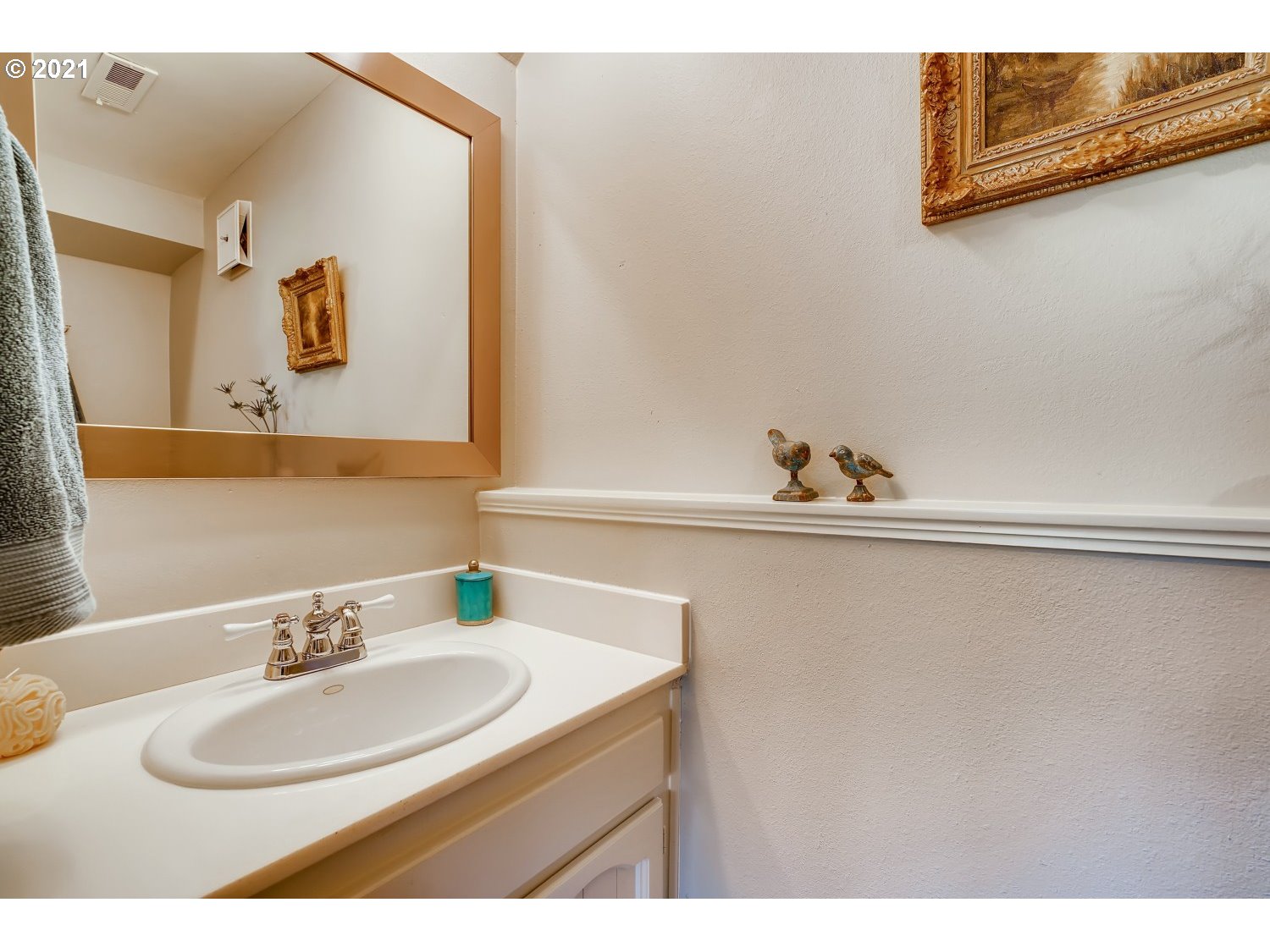 6530 Southwest View Point Terrace Portland, OR 97239 - Photo 29 of 32 a bathroom with a sink and a mirror