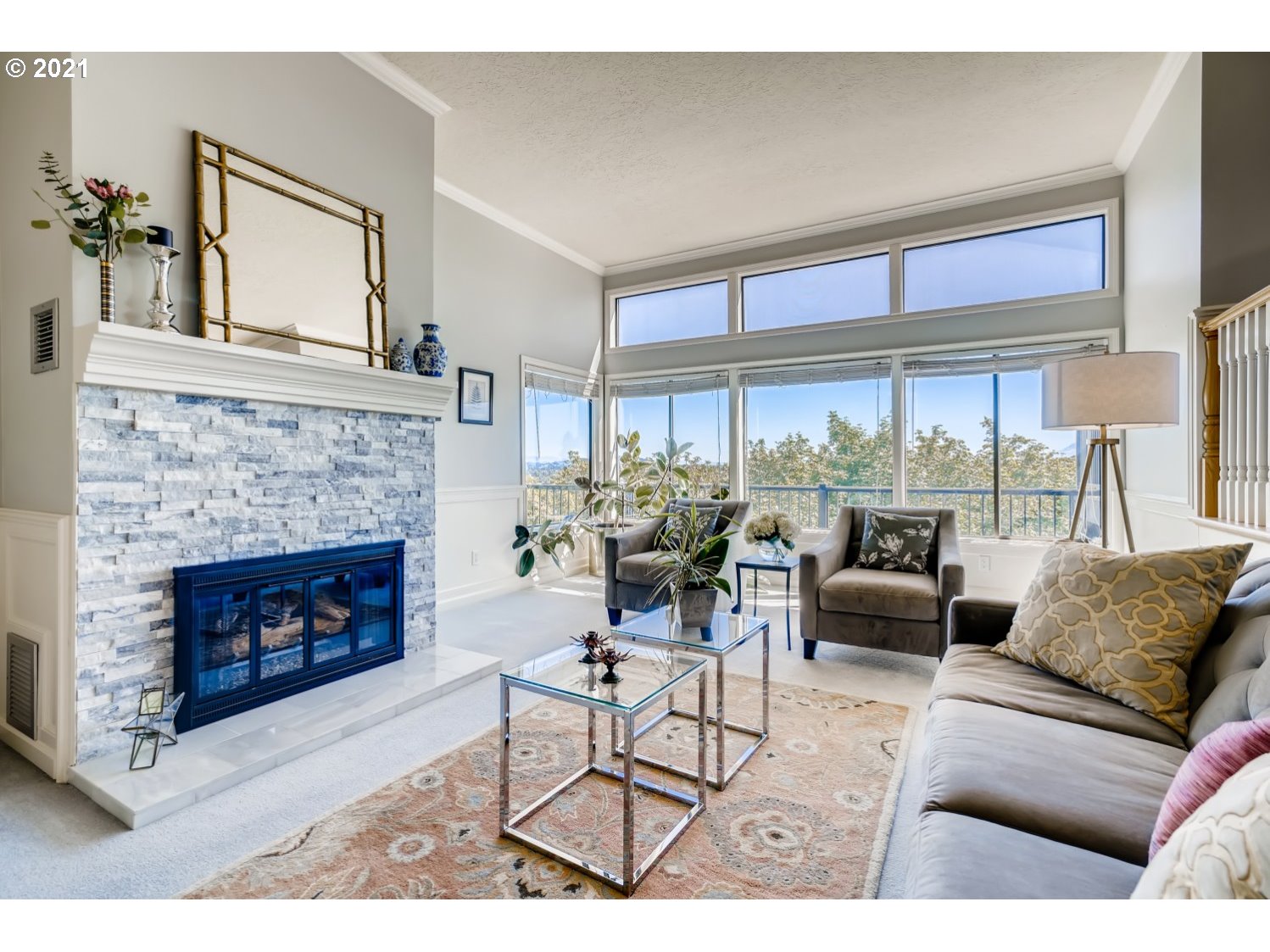 6530 Southwest View Point Terrace Portland, OR 97239 - Photo 3 of 32 a living room with furniture a fireplace and a large window