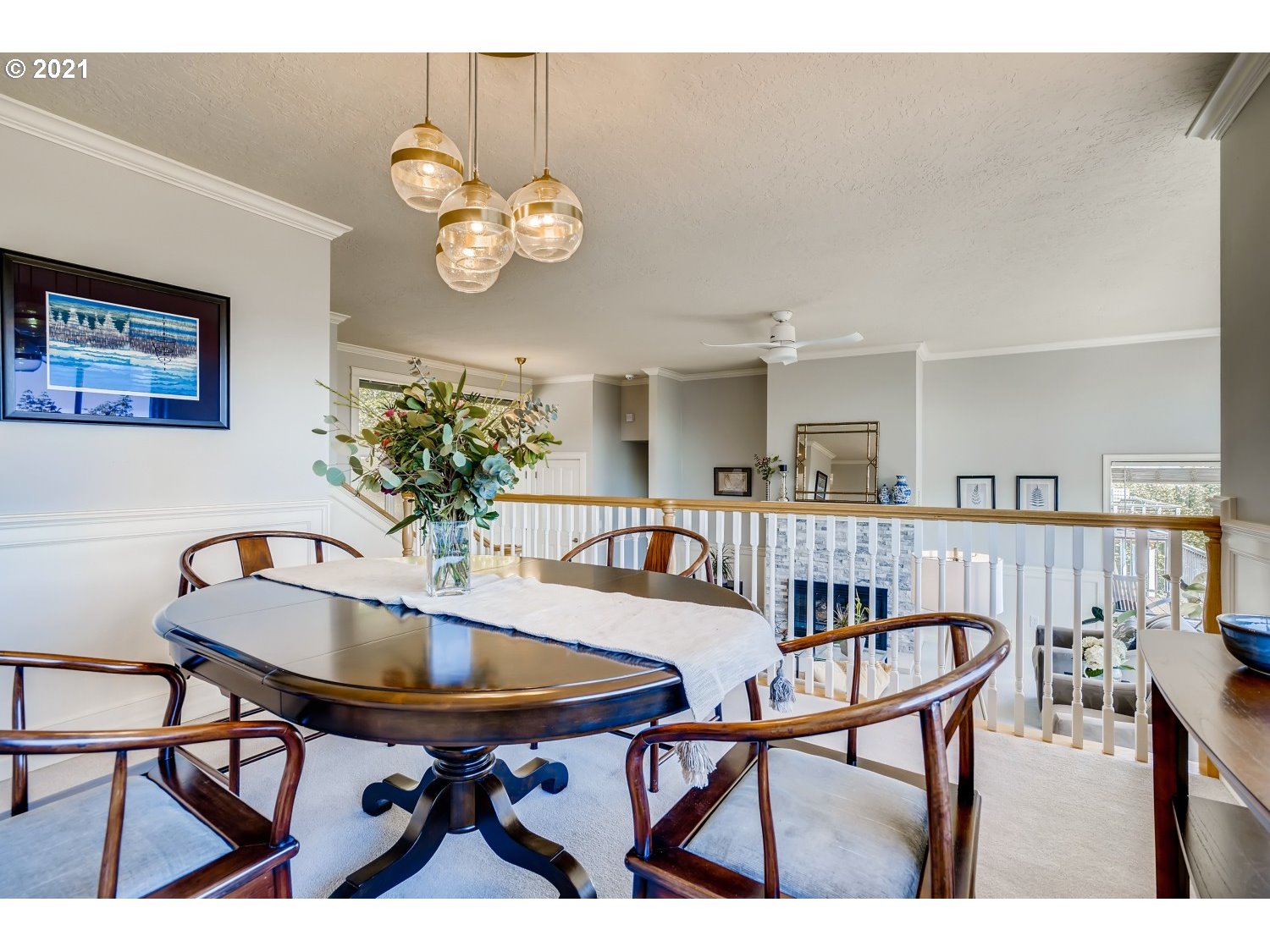6530 Southwest View Point Terrace Portland, OR 97239 - Photo 7 of 32 a view of a dining room and livingroom with furniture wooden floor and a rug