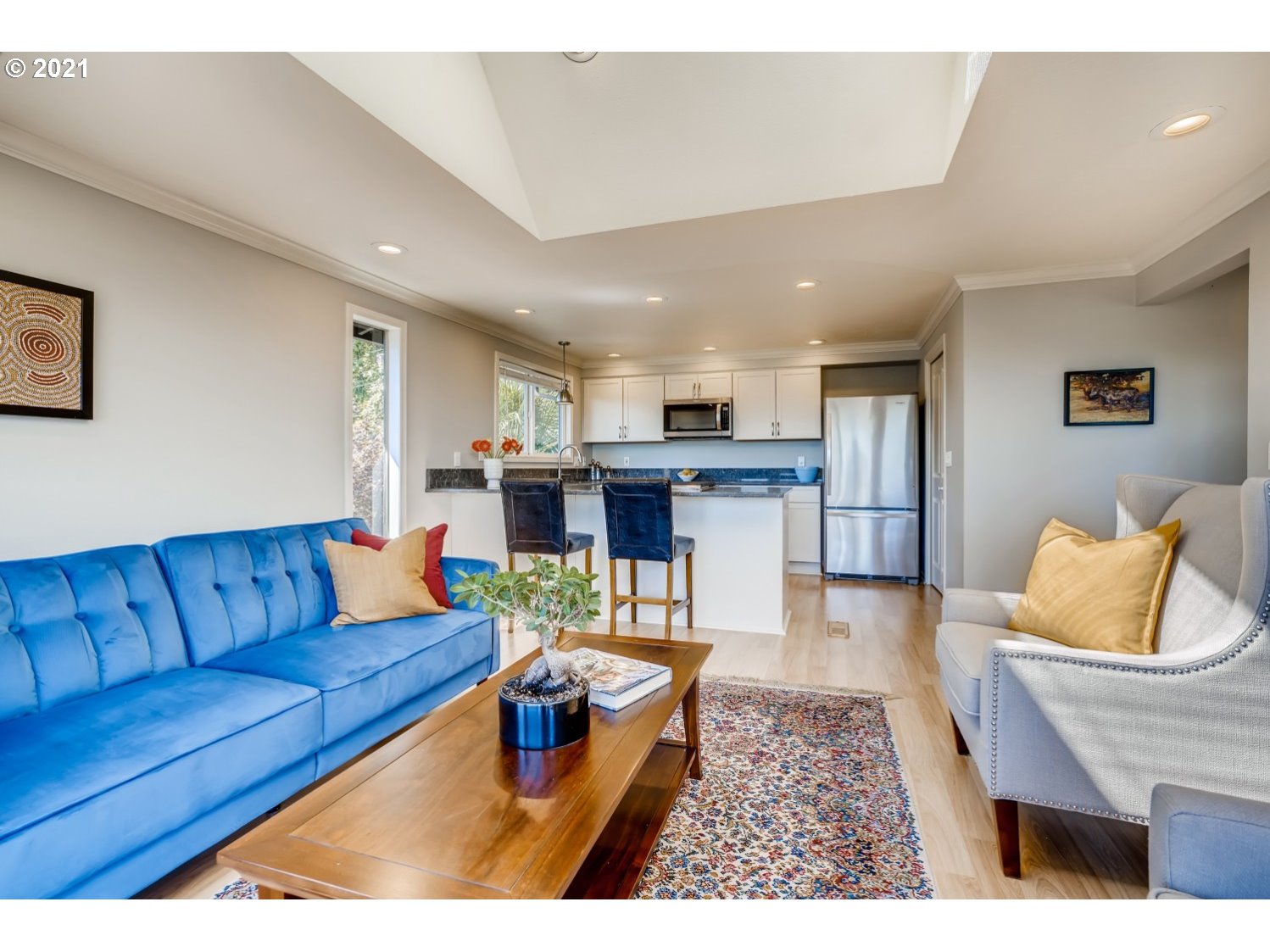 6530 Southwest View Point Terrace Portland, OR 97239 - Photo 10 of 32 a living room with furniture and a dining table with kitchen view