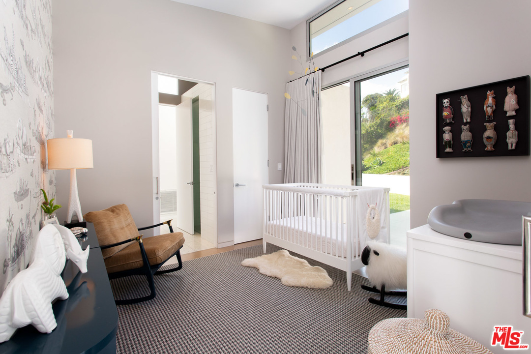 213 Pintoresca Drive Pacific Palisades, CA 90272 - Photo 14 of 23 a living room with furniture and a window