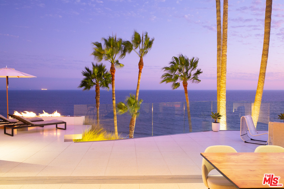 213 Pintoresca Drive Pacific Palisades, CA 90272 - Photo 19 of 23 a view of a swimming pool with a lounge chairs