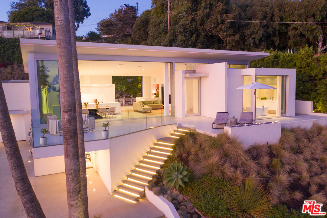 213 Pintoresca Drive Pacific Palisades, CA 90272 - Photo 21 of 23 a view of swimming pool with outdoor seating and plants