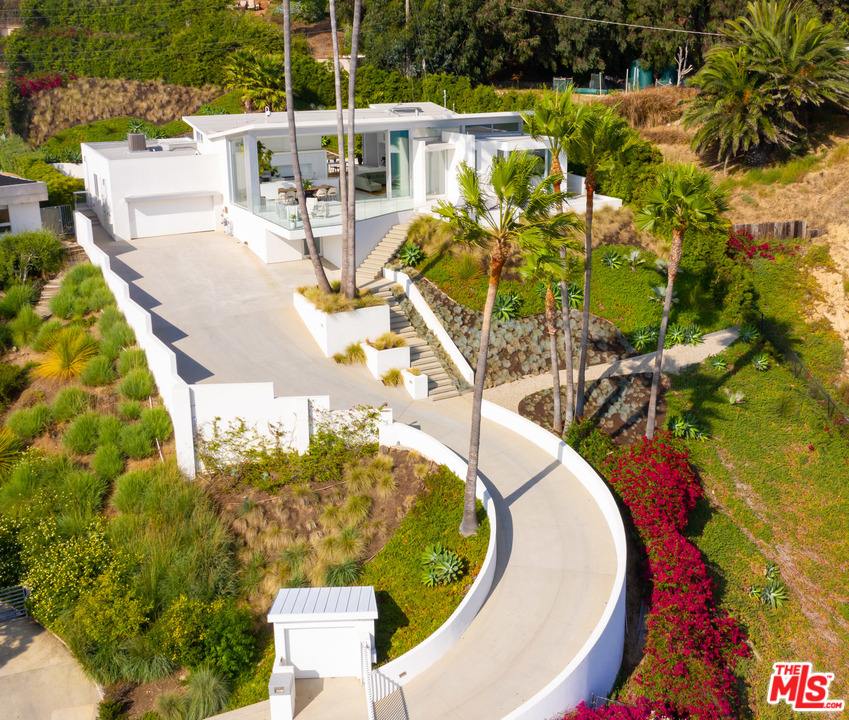 213 Pintoresca Drive Pacific Palisades, CA 90272 - Photo 23 of 23 a view of a swimming pool with a patio