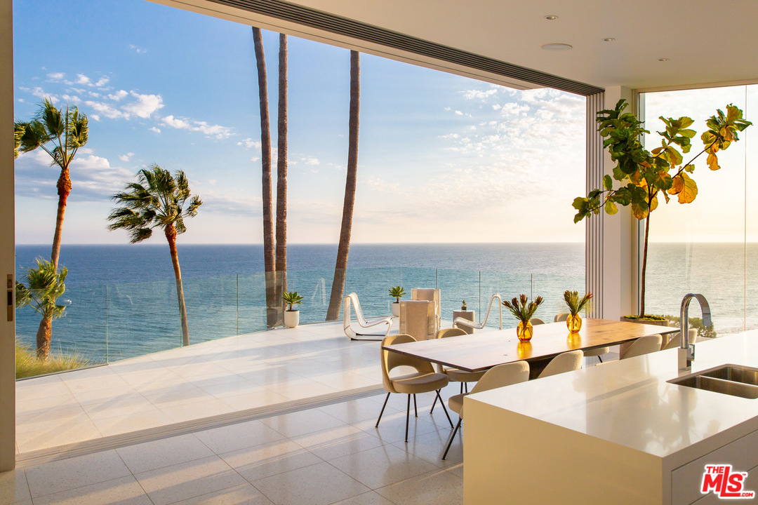 213 Pintoresca Drive Pacific Palisades, CA 90272 - Photo 4 of 23 view of living room with furniture and floor to ceiling window