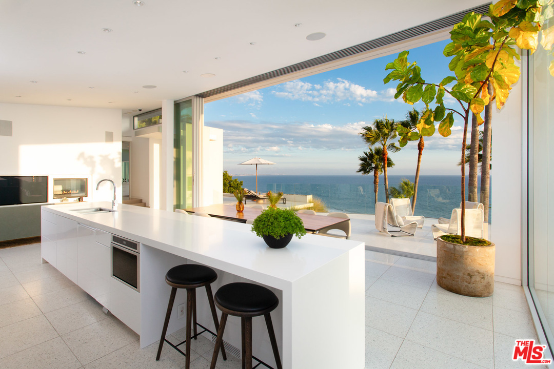213 Pintoresca Drive Pacific Palisades, CA 90272 - Photo 5 of 23 a kitchen with a sink and a large window
