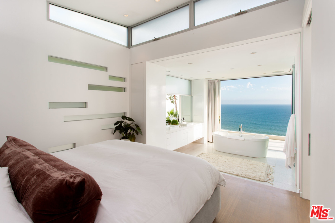 213 Pintoresca Drive Pacific Palisades, CA 90272 - Photo 10 of 23 a bedroom with a bed and window