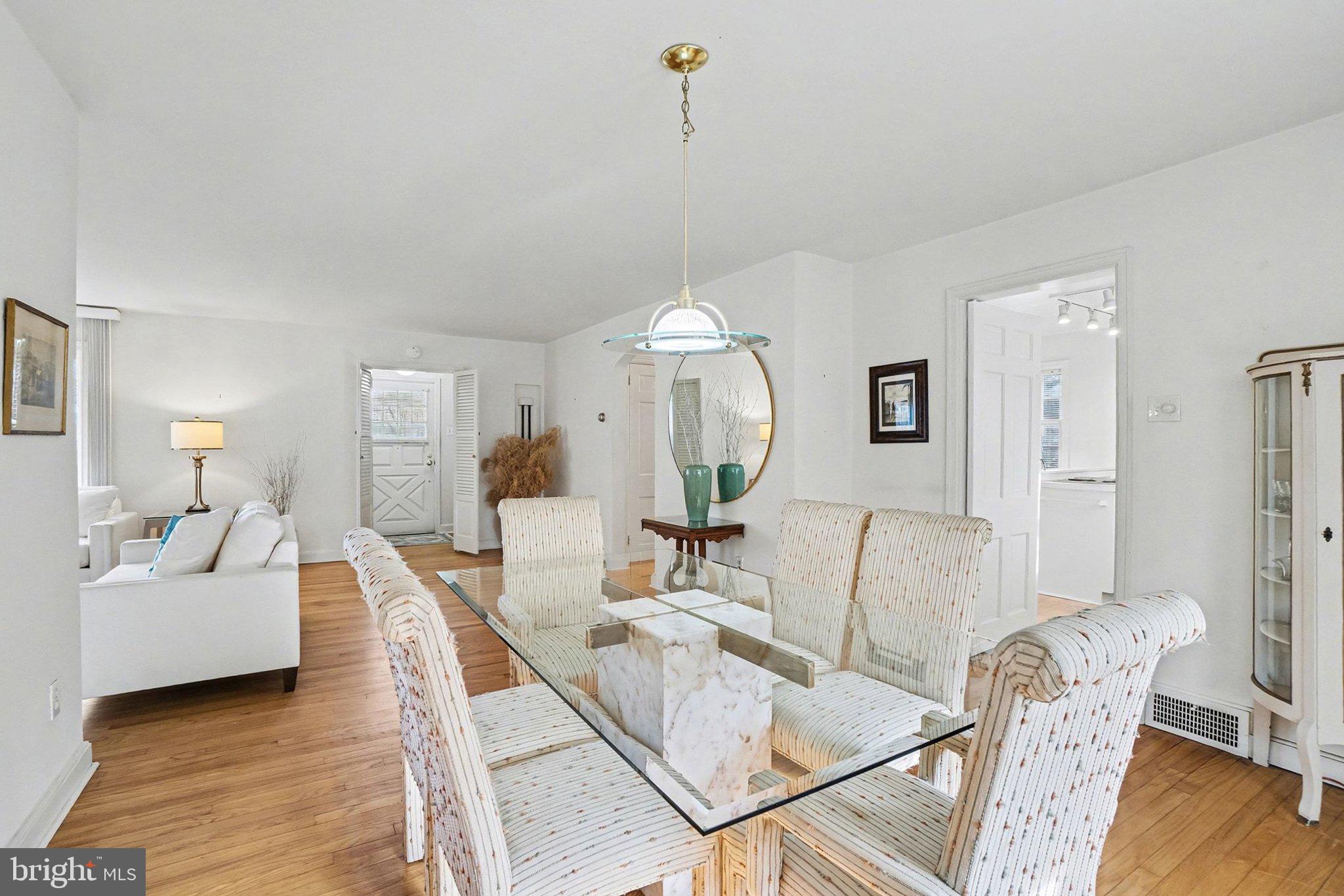 3603 Hillcrest Road Harrisburg, PA 17109 - Photo 9 of 34 a living room with furniture a chandelier and wooden floor