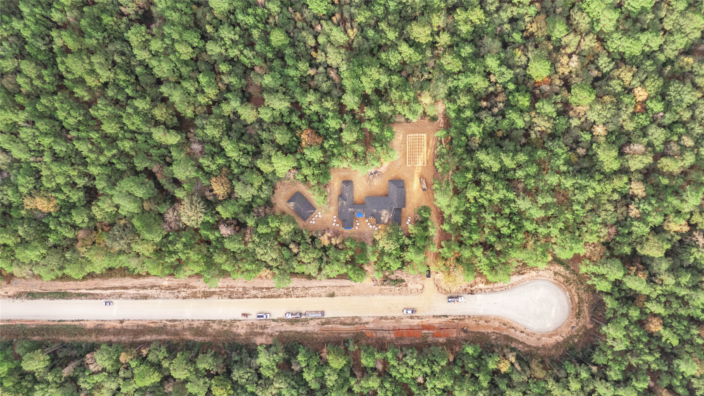 134 Splendid Road New Waverly, TX 77358 - Photo 3 of 17 a view of a yard with plants and a bench