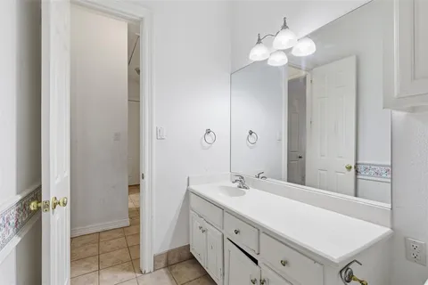 an empty room with a ceiling fan and a window