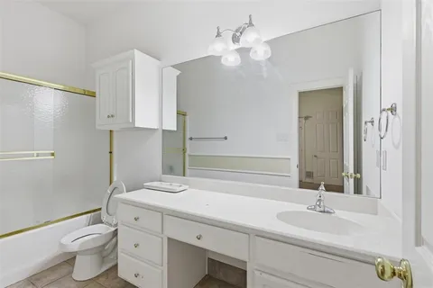 a bathroom with a tub and a shower