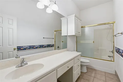 a view of a house with backyard and tree s