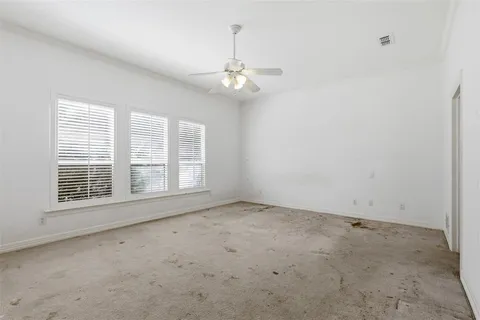 a view of a tree in front of a house