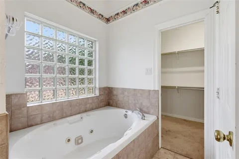 a view of a city with lush green forest