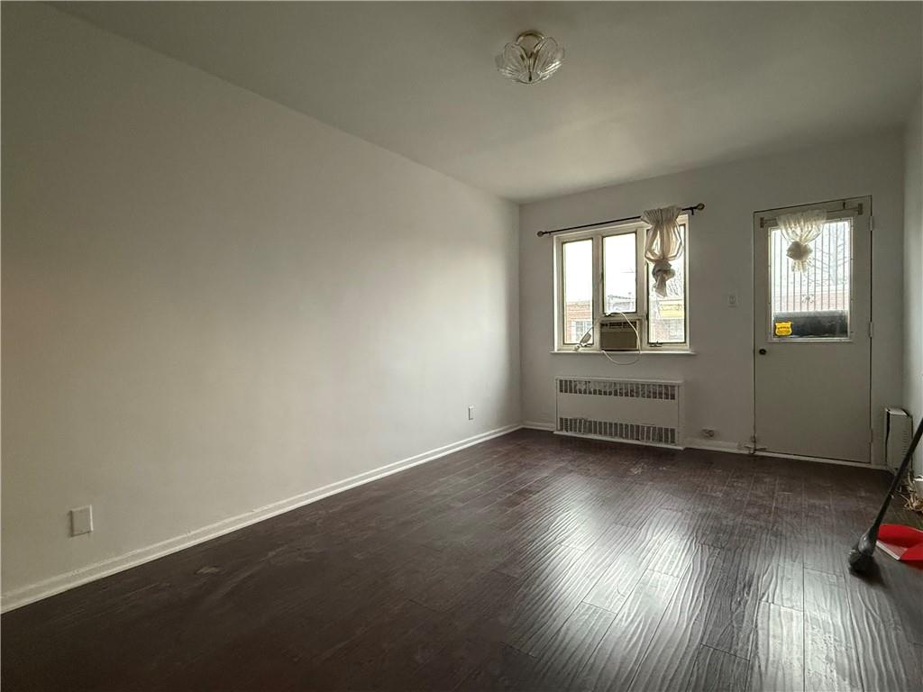 2373 Bragg Street Brooklyn, NY 11229 - Photo 4 of 11 an empty room with wooden floor and windows