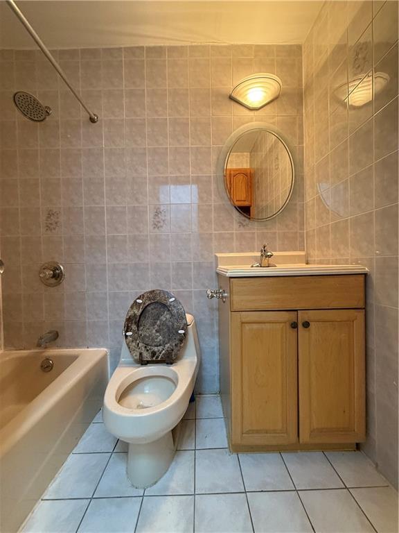 2373 Bragg Street Brooklyn, NY 11229 - Photo 9 of 11 a bathroom with a toilet a sink and mirror