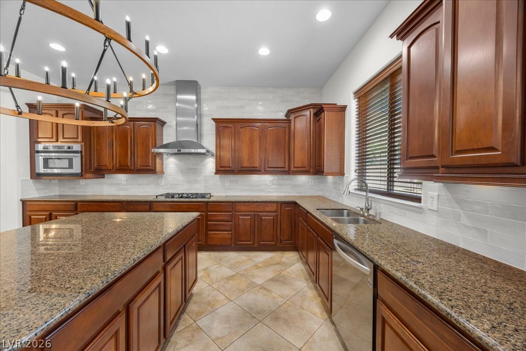 2125 De Rouge Avenue Henderson, NV 89044 - Photo 39 of 96 Culinary delights await in this modern kitchen, featuring sleek stainless steel appliances and durable granite countertops.