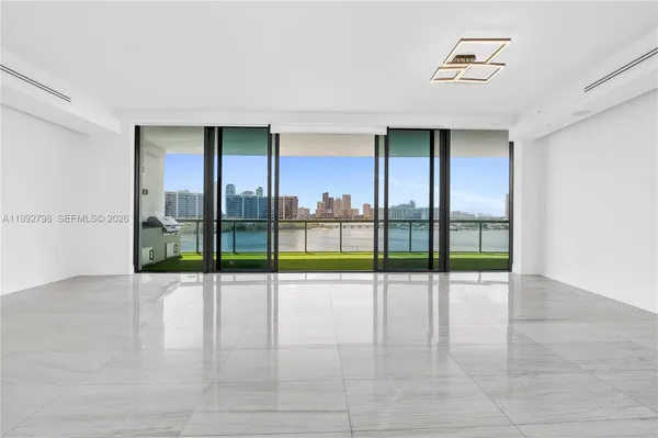 a view of an entryway with a floor to ceiling window