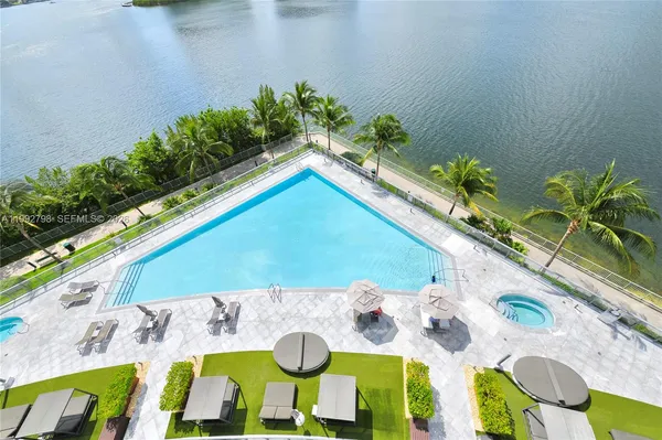 a view of swimming pool with a yard