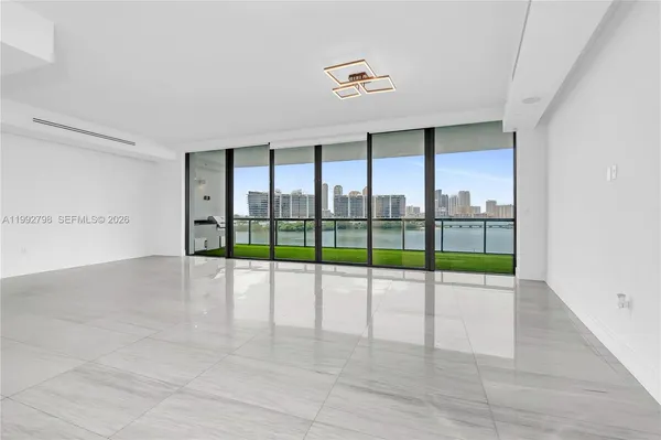 a view of an empty room with glass windows
