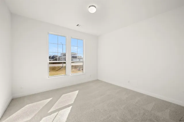 a bathroom with a tub a sink and mirror