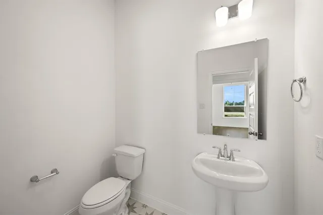 a view of an empty room with a fireplace