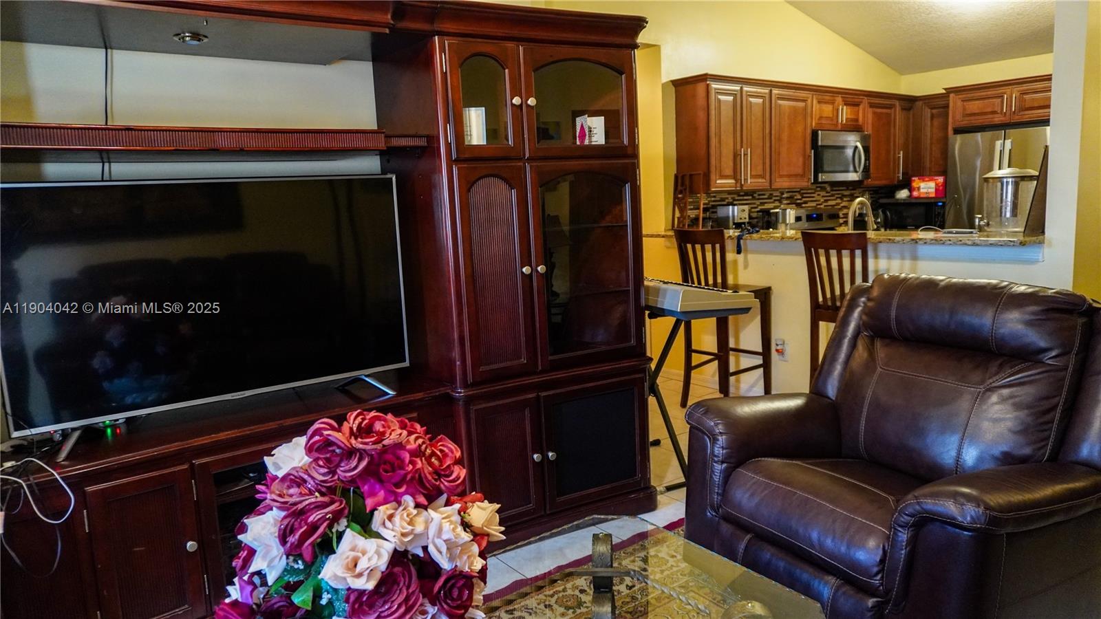 1496 24th Avenue Southwest Vero Beach, FL 32962 - Photo 13 of 21 a living room with furniture fireplace and flat screen tv
