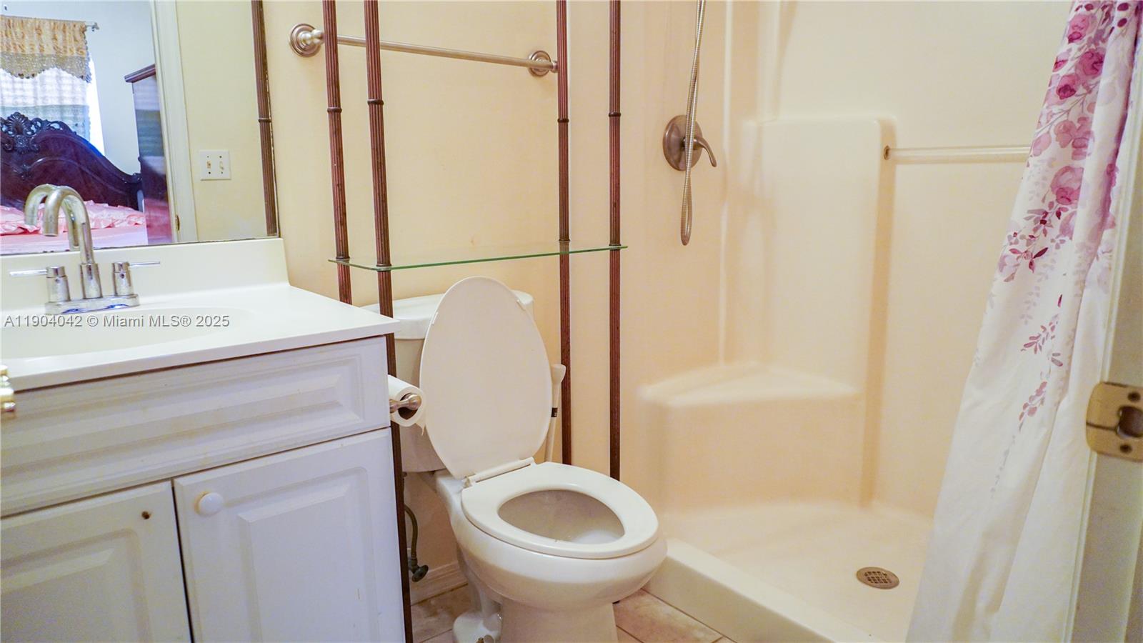 1496 24th Avenue Southwest Vero Beach, FL 32962 - Photo 19 of 21 a bathroom with a granite countertop sink toilet and shower