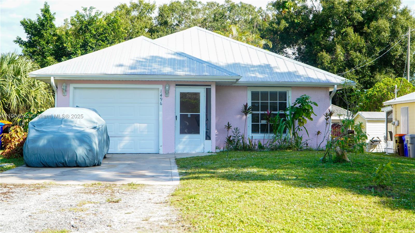 1496 24th Avenue Southwest Vero Beach, FL 32962 - Photo 3 of 21 a view of a house with backyard and garden