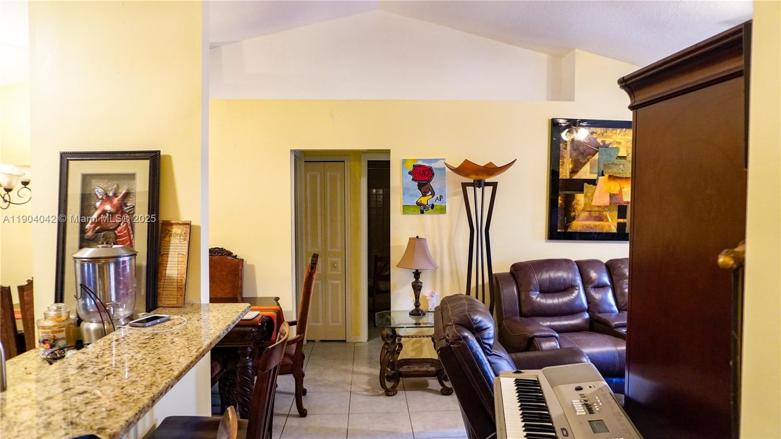 1496 24th Avenue Southwest Vero Beach, FL 32962 - Photo 5 of 21 a view of a workspace with furniture and a window