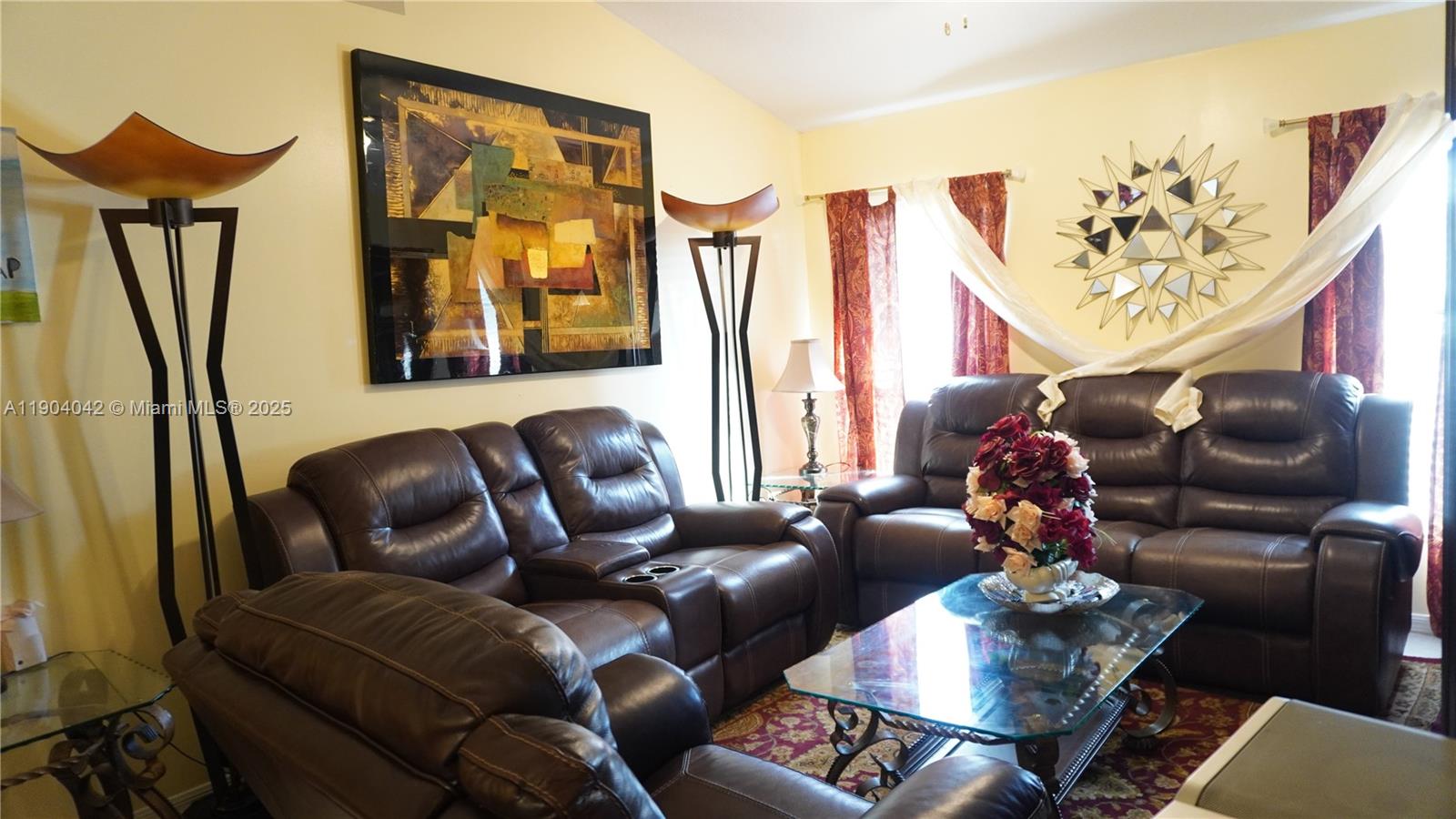 1496 24th Avenue Southwest Vero Beach, FL 32962 - Photo 7 of 21 a media room with lots of chairs and a chandelier