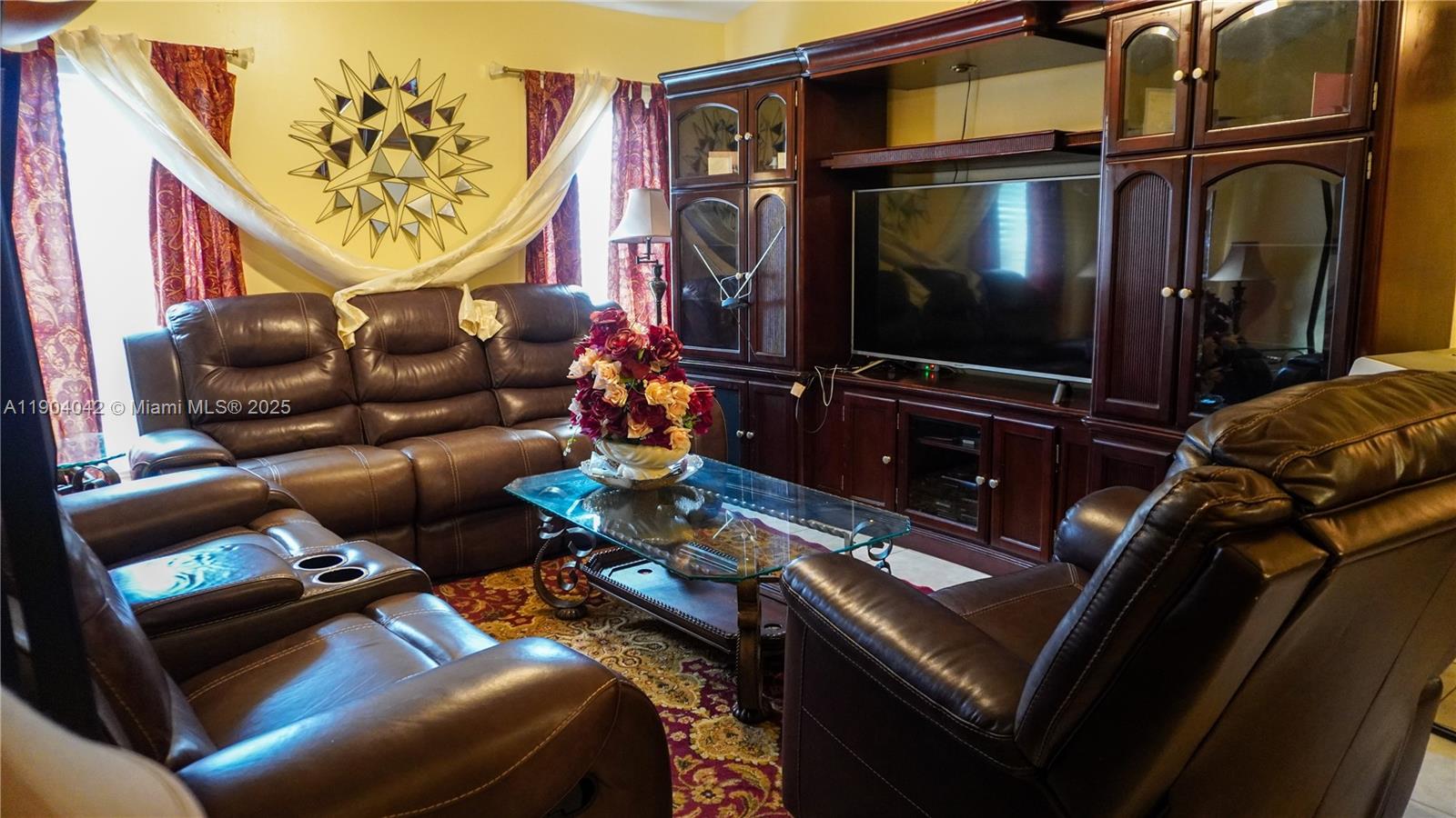 1496 24th Avenue Southwest Vero Beach, FL 32962 - Photo 8 of 21 a living room with furniture and a flat screen tv