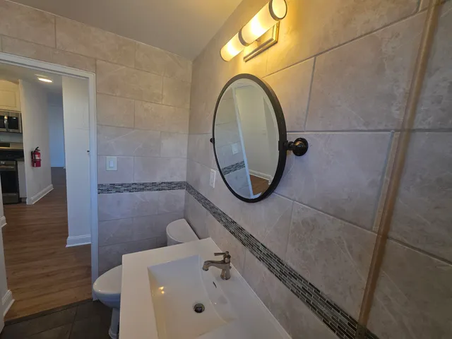 a bathroom with a sink and a mirror