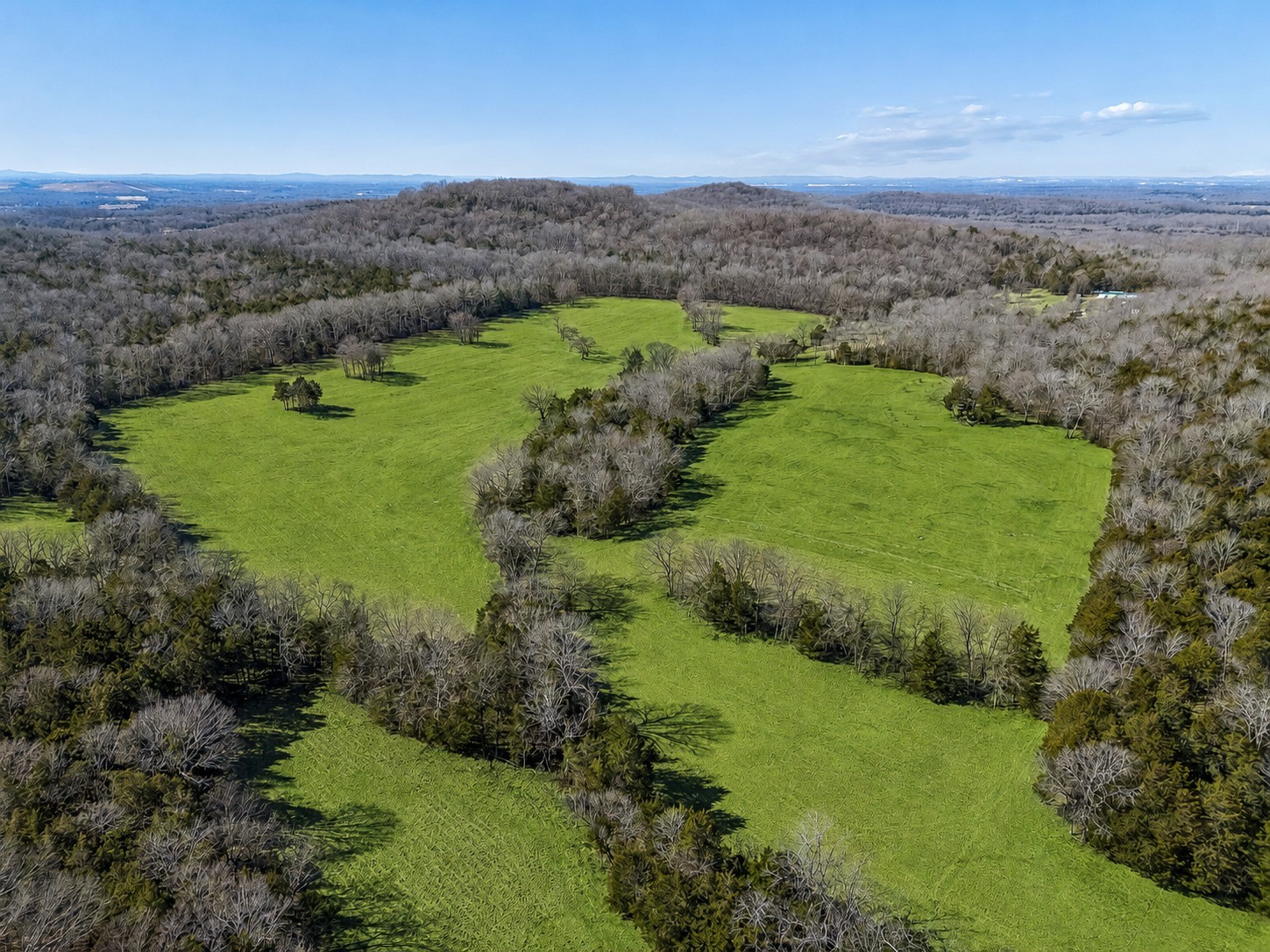 an aerial view of a golf course with ocean view