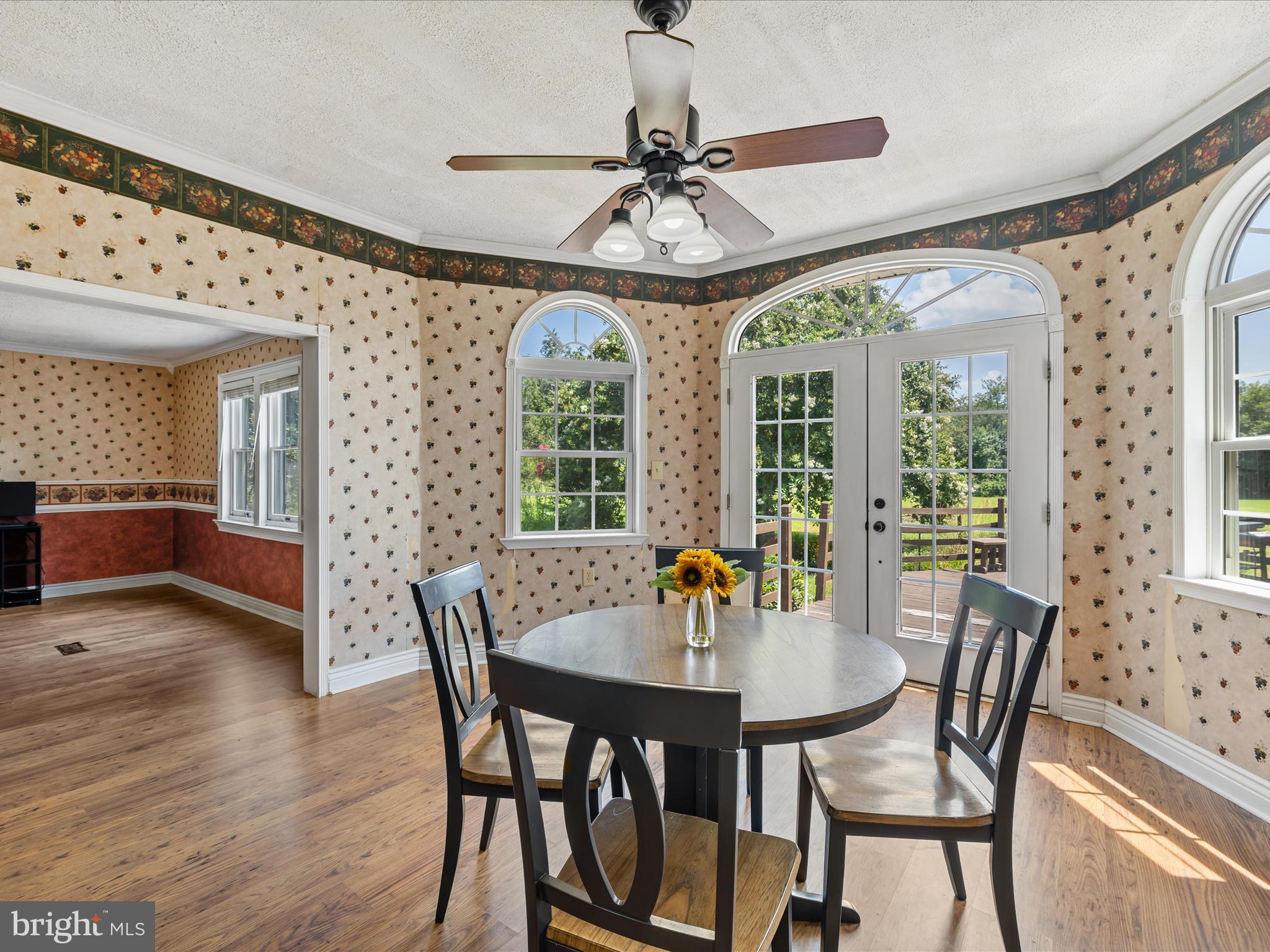 28495 Fire Tower Road Laurel, DE 19956 - Photo 12 of 31 a view of a dining room with furniture window and wooden floor