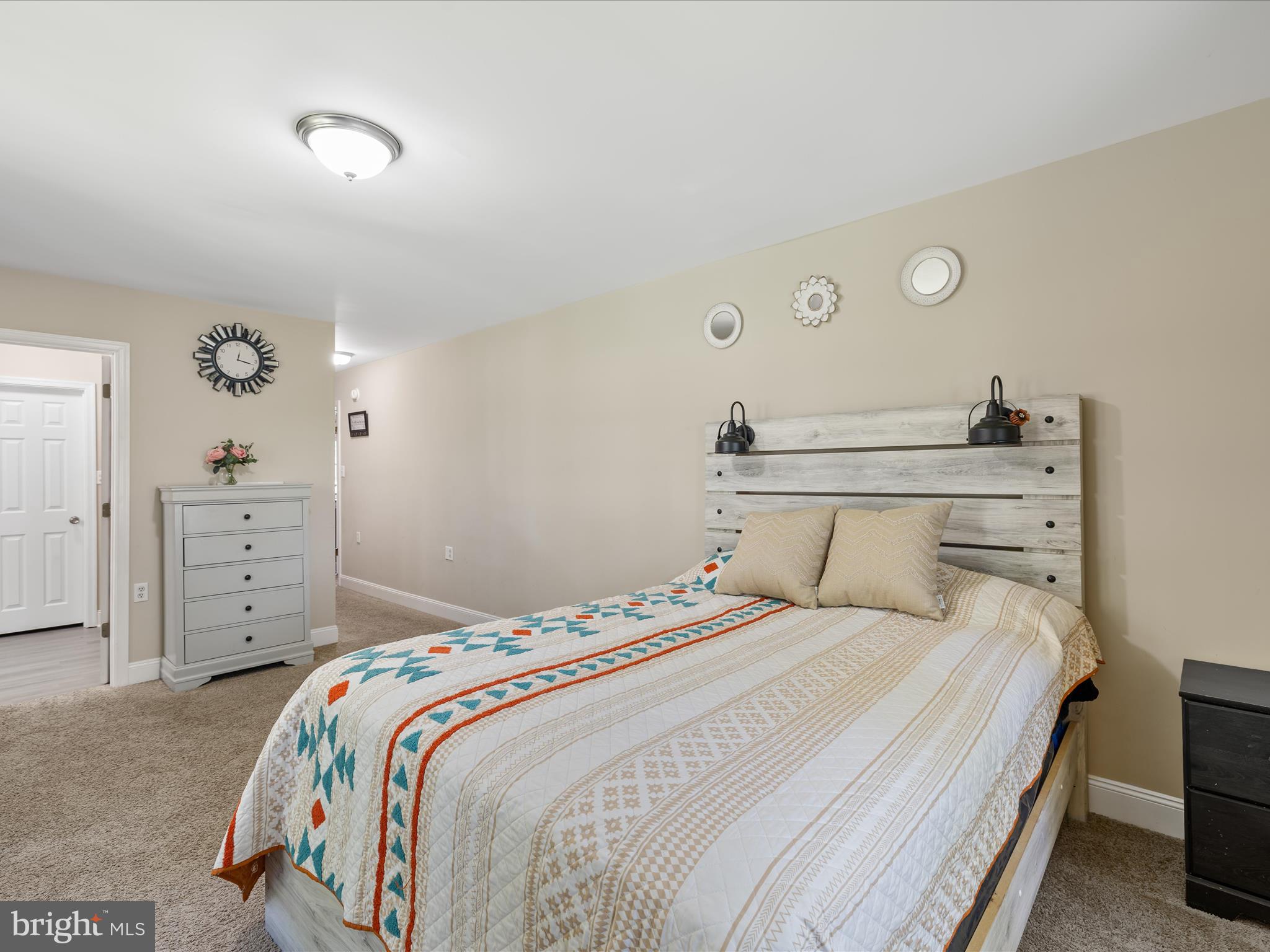 28495 Fire Tower Road Laurel, DE 19956 - Photo 18 of 31 a bedroom with a bed and a closet