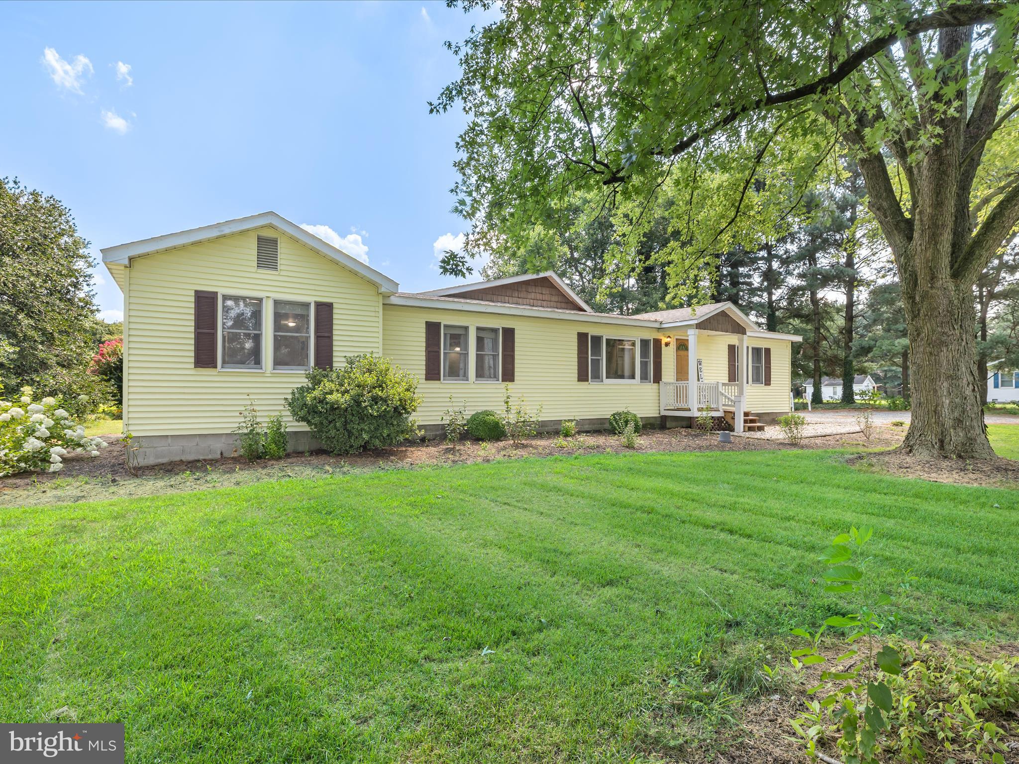 28495 Fire Tower Road Laurel, DE 19956 - Photo 2 of 31 a front view of a house with a garden