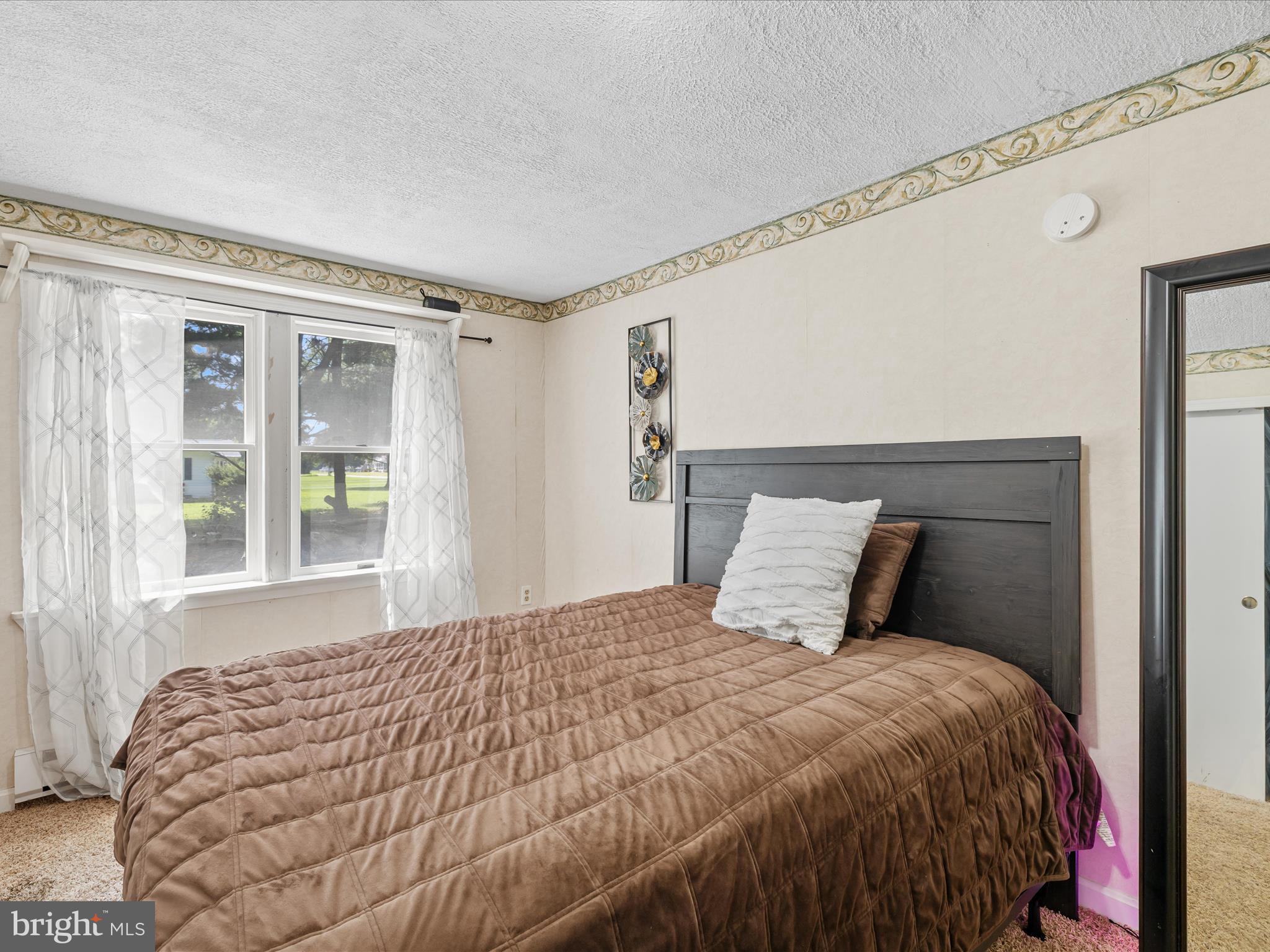 28495 Fire Tower Road Laurel, DE 19956 - Photo 23 of 31 a large bed sitting in a bedroom next to a window