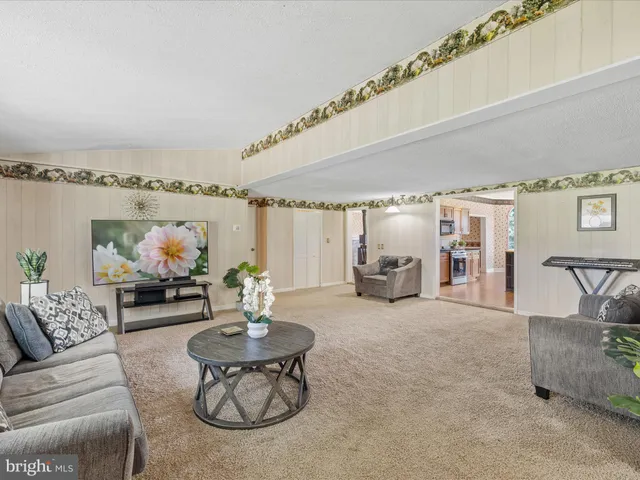 a living room with furniture and a table